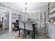 Cozy kitchen nook includes a high-top table and chairs, with natural light from the window at 800 Davenport St, Monroe, NC 28112