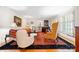 Classic living room showcases hardwood floors, piano, vintage chairs, and large bright windows at 800 Davenport St, Monroe, NC 28112