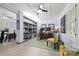 Inviting office space with custom bookshelves, bright windows, and modern ceiling fan creating a functional and stylish work area at 800 Davenport St, Monroe, NC 28112
