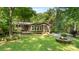 Inviting backyard featuring a cozy firepit area and deck, perfect for outdoor gatherings and serene relaxation at 8321 Walkup Rd, Waxhaw, NC 28173