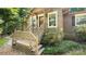 Inviting front porch detailing wood railings, perfect for enjoying peaceful mornings and serene evenings at 8321 Walkup Rd, Waxhaw, NC 28173