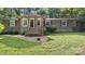 Welcoming home with well-manicured lawn, complemented by wood accents on the front porch at 8321 Walkup Rd, Waxhaw, NC 28173