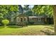 Charming home with inviting entrance, well-maintained lawn, and mature trees providing a peaceful setting at 8321 Walkup Rd, Waxhaw, NC 28173