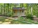 Charming outbuilding with front porch, nestled among lush greenery, providing a private retreat at 8321 Walkup Rd, Waxhaw, NC 28173
