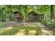 Delightful play area featuring a treehouse and separate outbuilding, surrounded by lush trees at 8321 Walkup Rd, Waxhaw, NC 28173
