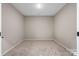 Empty bedroom with carpet and neutral walls at 8928 Morning Mist Rd, Charlotte, NC 28215