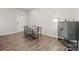Dining room features luxury vinyl floors, a modern table, and lots of light at 8928 Morning Mist Rd, Charlotte, NC 28215