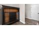 Hallway featuring luxury vinyl floors and a dark wood curio cabinet at 8928 Morning Mist Rd, Charlotte, NC 28215