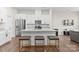 Modern kitchen with white cabinets, stainless steel appliances, granite countertops, and island with seating at 8928 Morning Mist Rd, Charlotte, NC 28215