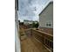 Private back deck with a wooden railing, perfect for enjoying the neighborhood views at 9236 Ainslie Downs St, Charlotte, NC 28273