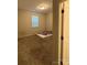 A cozy bedroom featuring neutral carpet, walls, and a window to let natural light in at 9236 Ainslie Downs St, Charlotte, NC 28273