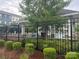 Community pool featuring a fence, outdoor seating, and mature landscaping at 9236 Ainslie Downs St, Charlotte, NC 28273