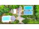 Overhead view of the community pool, parking, and tennis courts surrounded by lush trees at 134 Lake Spring Loop, Mooresville, NC 28117