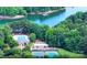 Aerial view of community amenities including a swimming pool, tennis courts and lake access at 134 Lake Spring Loop, Mooresville, NC 28117