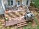 Multi-level wooden deck featuring outdoor furniture perfect for entertaining and relaxing at 134 Lake Spring Loop, Mooresville, NC 28117