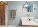 Cozy bathroom with tiled shower and neutral vanity with brushed bronze finishes at 134 Lake Spring Loop, Mooresville, NC 28117