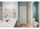 Bathroom with wood-look vanity, neutral paint, and tile flooring at 134 Lake Spring Loop, Mooresville, NC 28117
