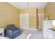 Bedroom featuring an armchair, double closets and light-filled ambiance at 134 Lake Spring Loop, Mooresville, NC 28117