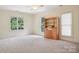 Bedroom with light walls, a bookcase, and carpeting at 134 Lake Spring Loop, Mooresville, NC 28117