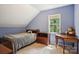 Bright secondary bedroom with light blue walls, carpet, and a window with natural light at 134 Lake Spring Loop, Mooresville, NC 28117