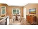 Cozy dining area with natural light, hardwood floors, and comfortable seating at 134 Lake Spring Loop, Mooresville, NC 28117