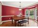 Bright dining room with wood table, bench seating, and natural light from bay windows at 134 Lake Spring Loop, Mooresville, NC 28117