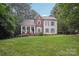 Charming two-story home with a welcoming front porch and manicured lawn at 134 Lake Spring Loop, Mooresville, NC 28117