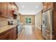 Spacious kitchen featuring stainless steel appliances, granite countertops, and hardwood floors at 134 Lake Spring Loop, Mooresville, NC 28117