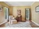 Inviting living room with hardwood floors, neutral walls, and windows with natural light at 134 Lake Spring Loop, Mooresville, NC 28117