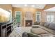 Inviting living room with a cozy fireplace, ample seating, and large windows at 134 Lake Spring Loop, Mooresville, NC 28117