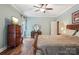 Spacious main bedroom with hardwood floors, dresser, and decorative vanity area at 134 Lake Spring Loop, Mooresville, NC 28117