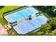 Aerial view of two outdoor tennis courts with parking and landscaping at 134 Lake Spring Loop, Mooresville, NC 28117