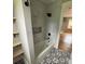 Beautifully remodeled bathroom featuring a shower/tub combo with stylish tile work at 410 Gann St, Lowell, NC 28098
