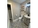 Stylish bathroom with patterned tile flooring, a modern vanity, and a closet at 410 Gann St, Lowell, NC 28098