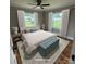 Bright bedroom with large windows, hardwood floors and neutral-toned decor at 410 Gann St, Lowell, NC 28098