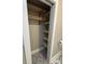 Bathroom closet with several rows of new wooden shelves and black metal brackets at 410 Gann St, Lowell, NC 28098