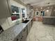 Modern kitchen with granite countertops, stainless steel appliances and an open floor plan at 410 Gann St, Lowell, NC 28098