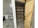 Spacious kitchen pantry with custom shelving and a sliding barn door for easy access at 410 Gann St, Lowell, NC 28098