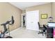 Bedroom with peloton bike, office equipment, and closet at 7023 Blakeney Greens Blvd, Charlotte, NC 28277