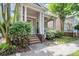 Inviting home with a classic covered porch, brick stairs, mature landscaping, and a sense of neighborhood charm at 7023 Blakeney Greens Blvd, Charlotte, NC 28277