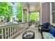 Cozy front porch with comfortable seating, ideal for relaxing and enjoying the neighborhood views at 7023 Blakeney Greens Blvd, Charlotte, NC 28277