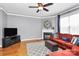 Living room showcases a fireplace, hardwood floors, and ample natural light at 7023 Blakeney Greens Blvd, Charlotte, NC 28277