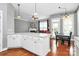 Open-concept living and dining area showcasing hardwood floors and natural light at 7023 Blakeney Greens Blvd, Charlotte, NC 28277