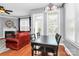 Well-lit living room includes hardwood floors and a view to the adjacent dining area at 7023 Blakeney Greens Blvd, Charlotte, NC 28277