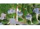 Aerial view of the property with red boundary lines, indicating the home's lot with mature trees at 10024 Tealridge Ln, Charlotte, NC 28277