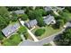 Aerial view of a home with a driveway, fenced yard, mature landscaping, and neighboring homes at 10024 Tealridge Ln, Charlotte, NC 28277