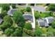 Aerial view of property featuring a backyard deck, mature landscaping, and neighboring homes at 10024 Tealridge Ln, Charlotte, NC 28277