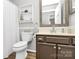 Traditional bathroom featuring a toilet, vanity with framed mirror, and a shower with curtain at 10024 Tealridge Ln, Charlotte, NC 28277
