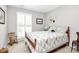 Cozy bedroom with natural light and beautiful quilt at 10024 Tealridge Ln, Charlotte, NC 28277
