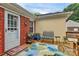 Inviting outdoor deck with seating, rug, and a red brick exterior, perfect for relaxing outdoors at 10024 Tealridge Ln, Charlotte, NC 28277
